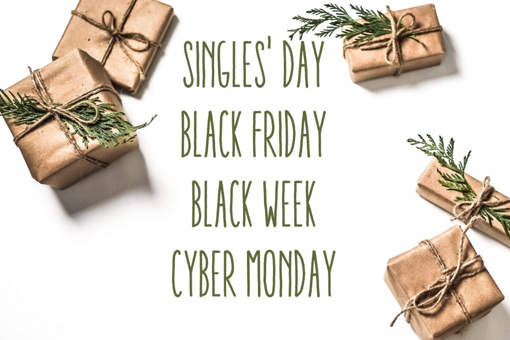 Tekstit Singles' Day, Black Friday, Black Week, Cyber Monday, taustalla lahjapaketteja